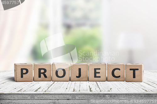 Image of Wooden project sign in a bright room