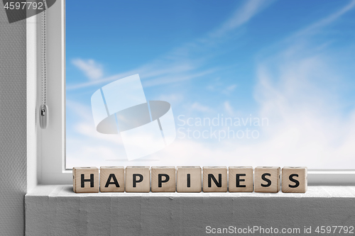 Image of Happiness sign in a window sill