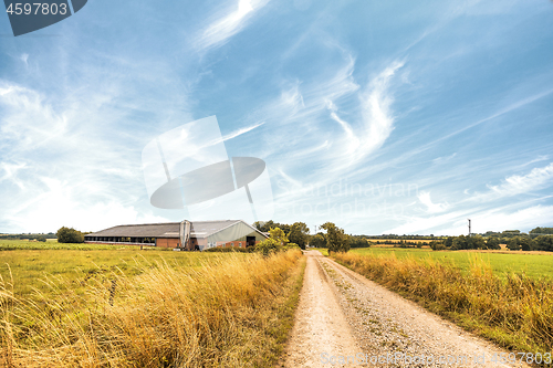 Image of Farm house near a road in a rural countryside