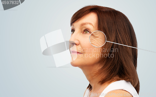 Image of senior woman with zoomed eye wrinkles