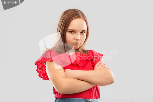 Image of displeased girl with crossed arms pouting