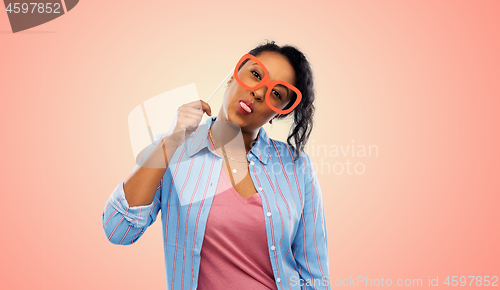 Image of happy african american woman with big glasses