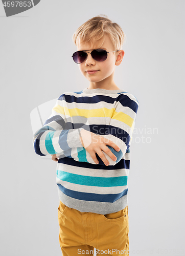 Image of portrait of boy in sunglasses and striped pullover
