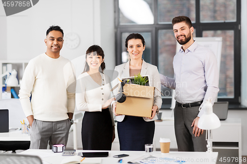 Image of new female employee with colleagues at office