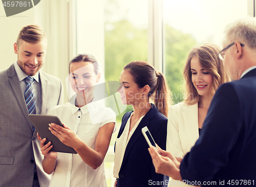 Image of business people with tablet pc computers at office