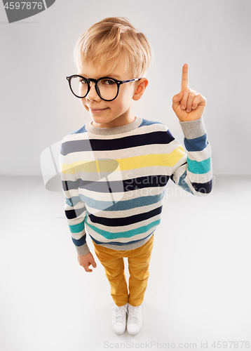 Image of smiling boy in glasses and striped pullover