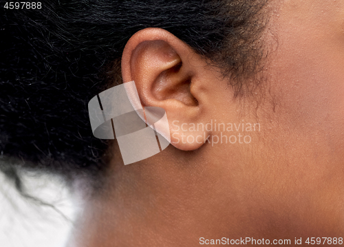 Image of close up of young woman ear