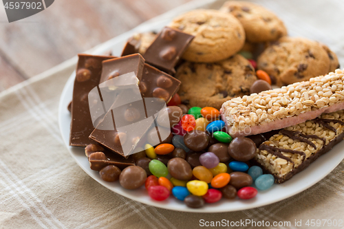 Image of chocolate, cookies, candies and muesli bars