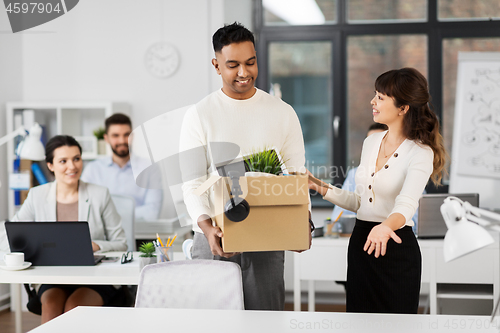 Image of new male employee meeting colleagues at office