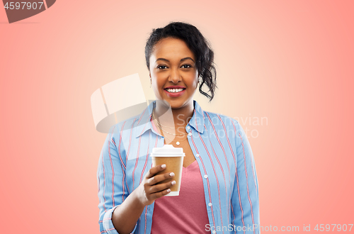 Image of happy african american woman drinking coffee