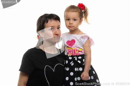 Image of Portrait of a mother with a four-year-old daughter on a white background