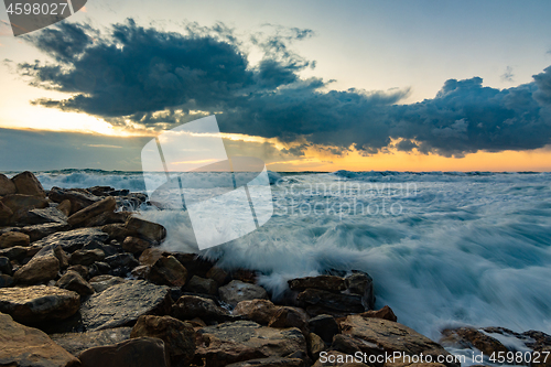 Image of Seascape on rocky shore in storm