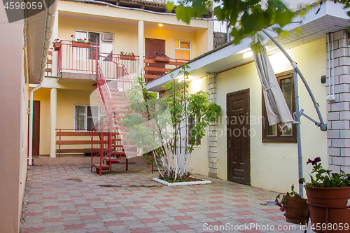 Image of The exterior of the courtyard of a small guest house