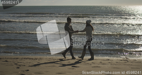 Image of Romantic Couple Relaxing On The Beach