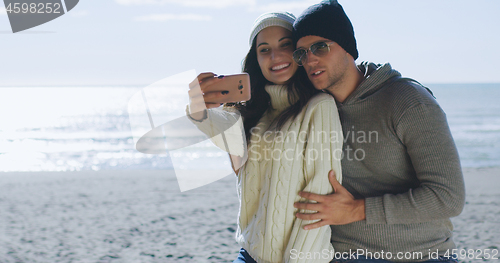 Image of Gorgeous couple taking picture of herselfe