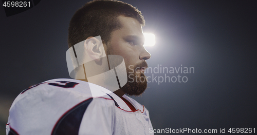 Image of portrait of young confident American football player