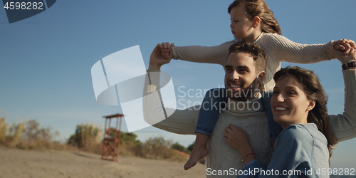 Image of Young family enjoying vecation during autumn