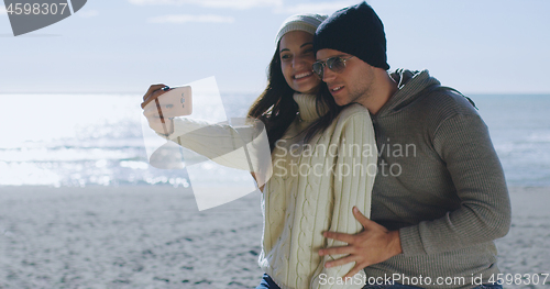 Image of Gorgeous couple taking picture of herselfe