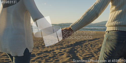 Image of Romantic Couple Relaxing On The Beach