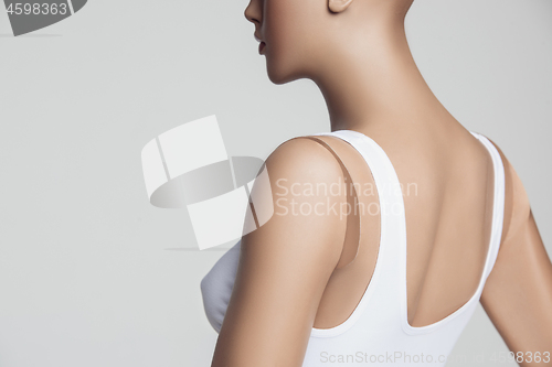 Image of The female mannequin over gray studio background