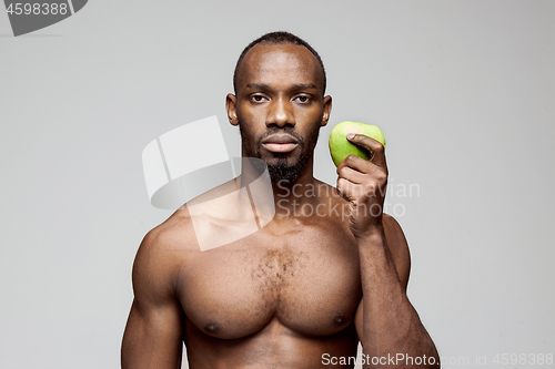 Image of Fit young man with beautiful torso isolated on white background