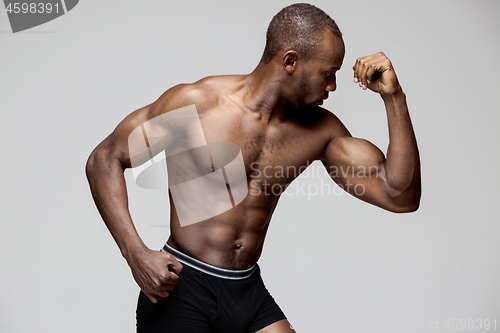 Image of Fit young man with beautiful torso isolated on white background