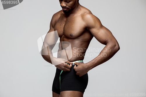 Image of Fit young man with beautiful torso isolated on white background