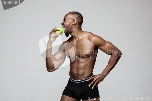 Image of Fit young man with beautiful torso isolated on white background