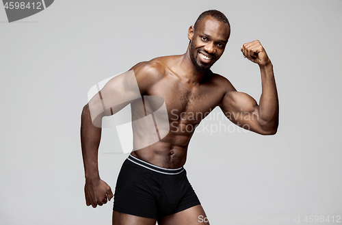 Image of Fit young man with beautiful torso isolated on white background