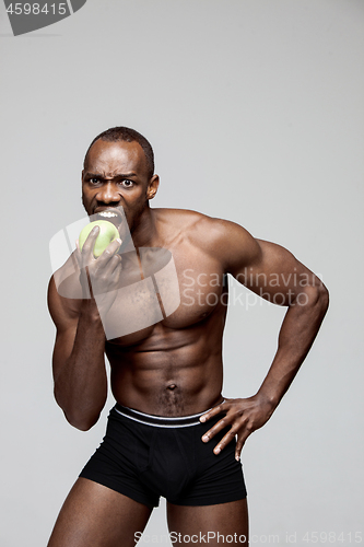 Image of Fit young man with beautiful torso isolated on white background