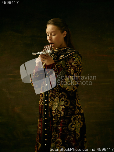 Image of Girl standing in Russian traditional costume.