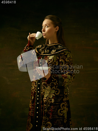 Image of Girl standing in Russian traditional costume.