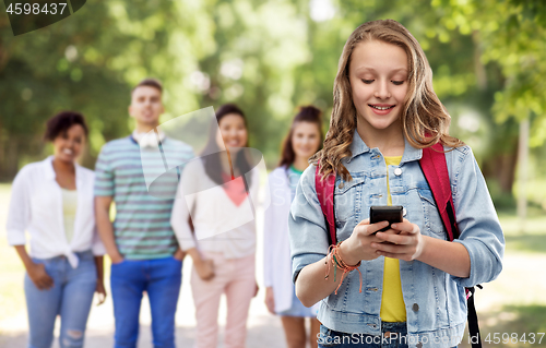 Image of teen student girl with school bag and smartphone