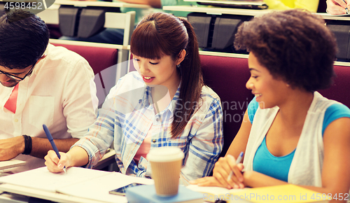 Image of group of international students talking on lecture