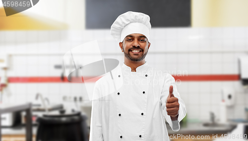 Image of indian chef shows thumbs up at restaurant kitchen