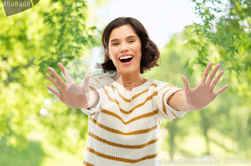 Image of happy woman showing ten fingers of two hands