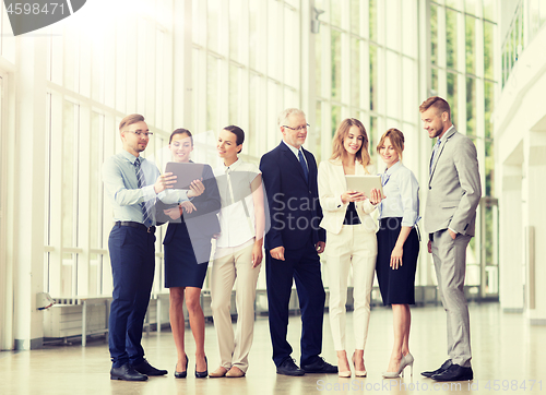 Image of business people with tablet pc computers at office