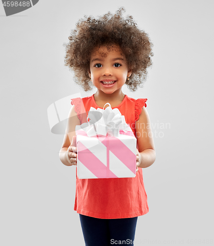 Image of happy little african american girl with gift box