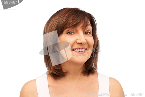 Image of portrait of smiling senior woman over white