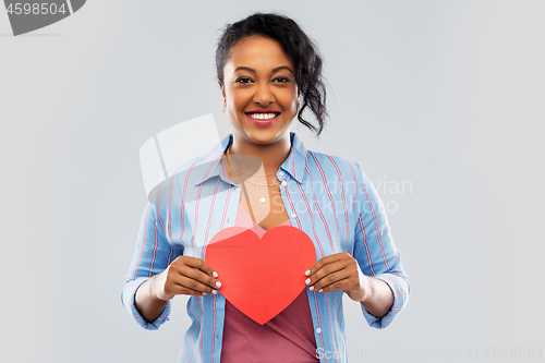 Image of happy african american woman with red heart