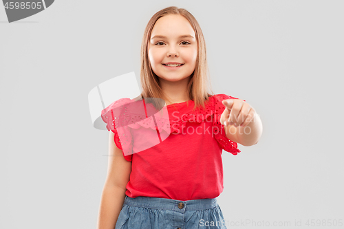 Image of smiling girl in red shirt pointing to you