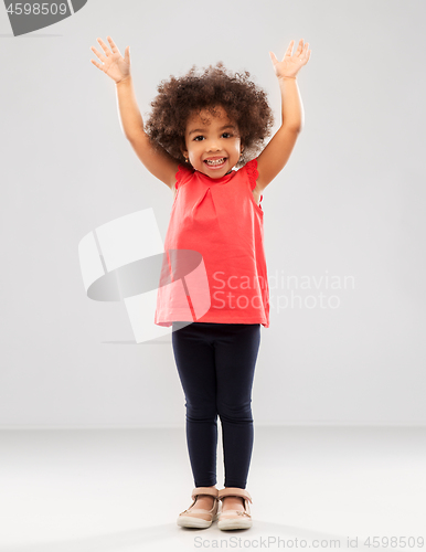 Image of happy little african american girl with hands up