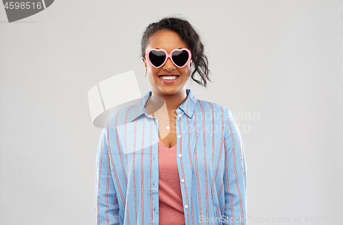 Image of african american woman in heart-shaped sunglasses