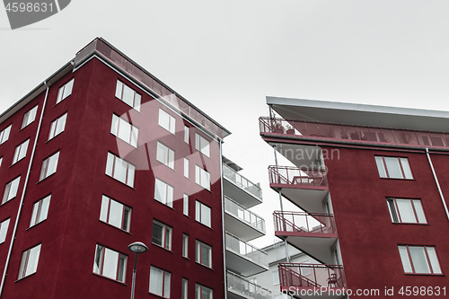 Image of Corners of modern dark red buildings