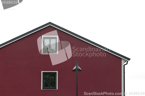 Image of Streetlight in front of modern red house