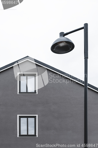 Image of House with two windows and streetlamp