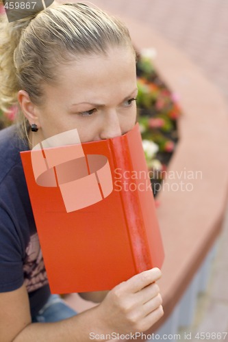 Image of woman with red book