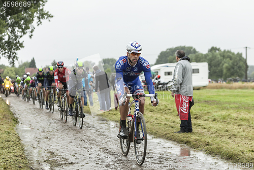 Image of The Cyclist William Bonnet on a Cobblestone Road - Tour de Franc