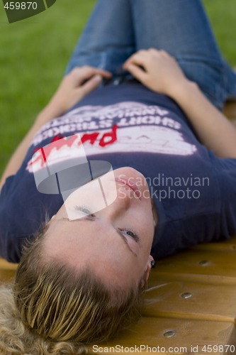 Image of woman relaxing in the park