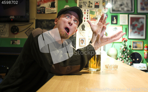 Image of Guy smokes in the bar